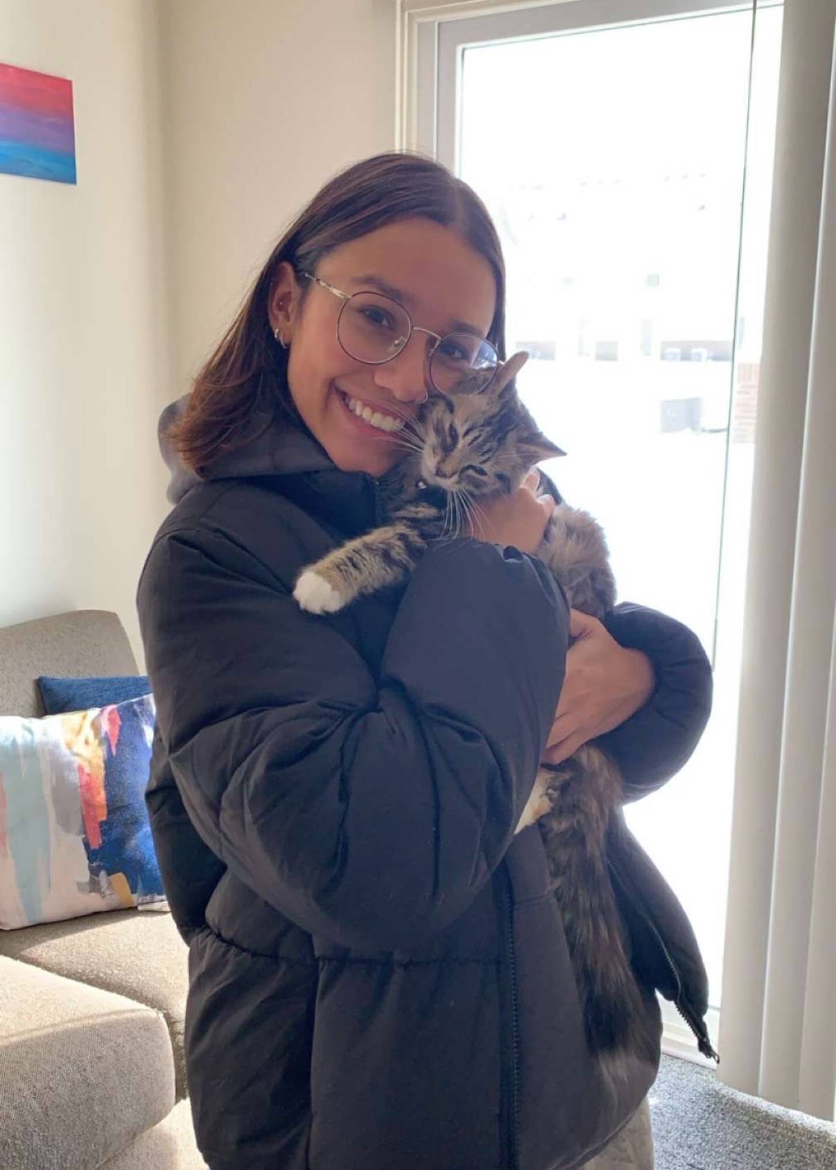 Photo of Abigail with a cat